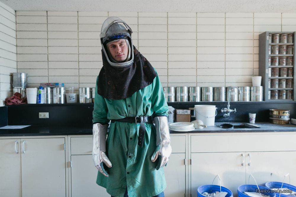 laboratory worker in chemical protection suit